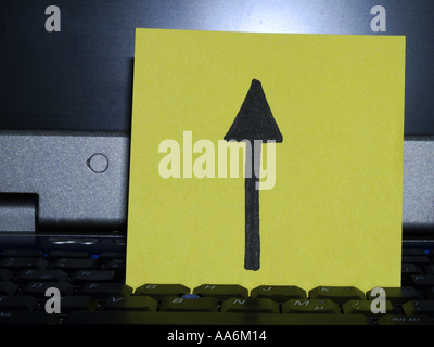 memo note on notebook, arrow up drawing Stock Photo