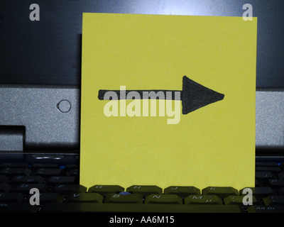 memo note on notebook, arrow right drawing Stock Photo