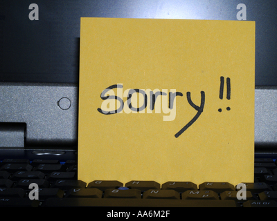Memo note on notebook, sorry Stock Photo - Alamy