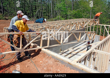 Rough framing crew from Mexico and Guadamala working in Atlanta USA on new house construction Stock Photo