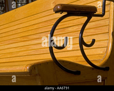 Detail on sunlit wooden bench and armrest on traditional cable cars in San Francisco City California USA Stock Photo