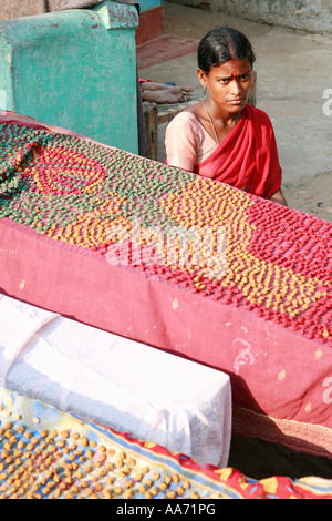 Woman selling Bengali sweets on Puri beach, Orissa, India Stock Photo