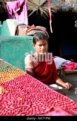 Woman selling Bengali sweets on Puri beach, Orissa, India Stock Photo