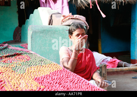 Woman selling Bengali sweets on Puri beach, Orissa, India Stock Photo