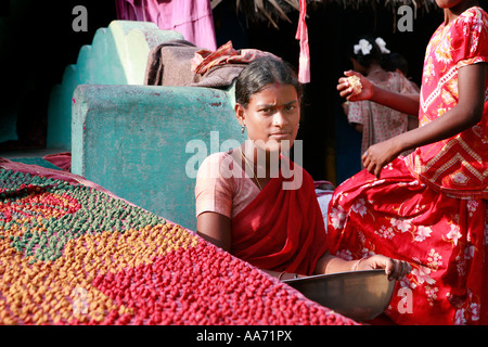 Women selling Bengali sweets on Puri beach, Orissa, India Stock Photo