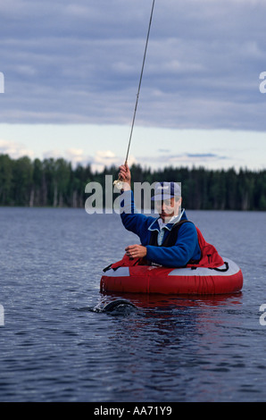 Boy fly fishing from float tube in small lake, British Columbia, Canada  Stock Photo - Alamy