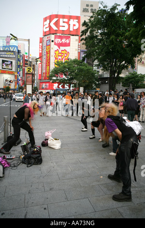 JPN Japan Tokyo Shinjuku district Teenager dancing and head banging to punk music Stock Photo