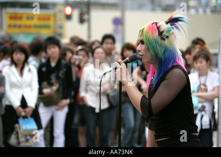 JPN Japan Tokyo Shinjuku district Teenager dancing and head banging to punk music Stock Photo