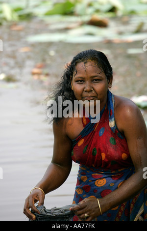 Woman bathing at Bolgarh village, Orissa, India Stock Photo