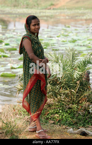 Woman bathing at Bolgarh village, Orissa, India Stock Photo