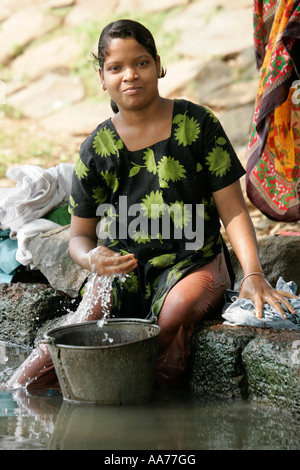 Woman washing at Bolgarh village, Orissa, India Stock Photo