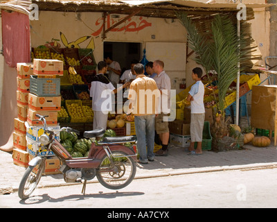 Tourist and local customers buy fruit at road side shop Tunisia Stock Photo