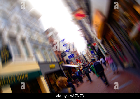 Dynamic radial lens shot of the popular shopping thoroughfare Kalverstraat in the centre of Amsterdam Holland Stock Photo