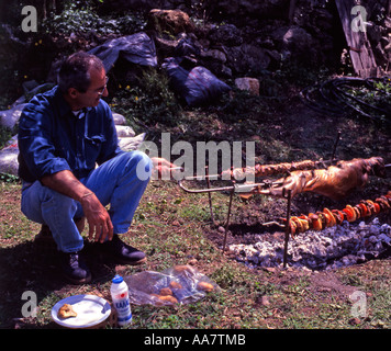 Greece Crete Whole lamb being roasted on a Spit on Easter Sunday Stock Photo