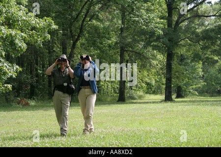 Alabama Morgan County,Decatur,Hospitality Nature Park,birding,birders,adult adults man men male,woman women female lady,binoculars,trees,visitors trav Stock Photo