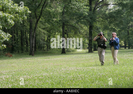 Alabama Morgan County,Decatur,Hospitality Nature Park,birding,birders,adult adults man men male,woman women female lady,binoculars,trees,visitors trav Stock Photo