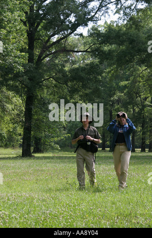 Alabama Morgan County,Decatur,Hospitality Nature Park,birding,birders,adult adults man men male,woman women female lady,binoculars,trees,visitors trav Stock Photo