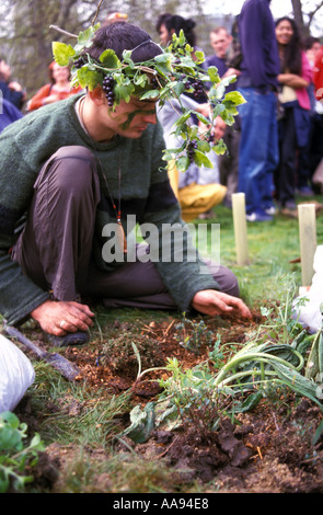 Urban guerrilla demonstrators  planting flowers trees and plants in Parliament square during Mayday 2001 demonstrations in an at Stock Photo
