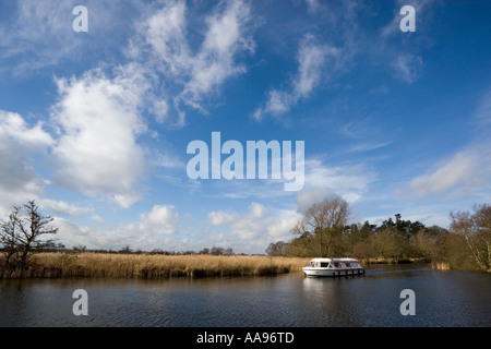 A pleasure craft on the Norfolk Broads in the UK Stock Photo