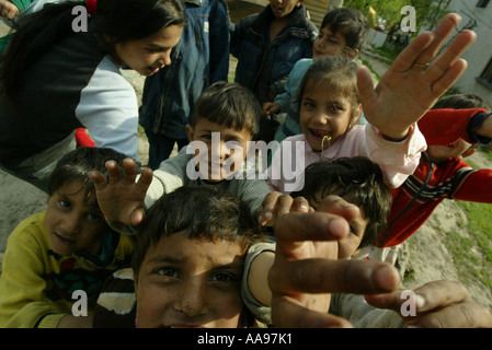 A GROUP OF ROMA GYPSEY CHILDREN ON A SITE IN KOSICE, SLOVAKIA Stock Photo