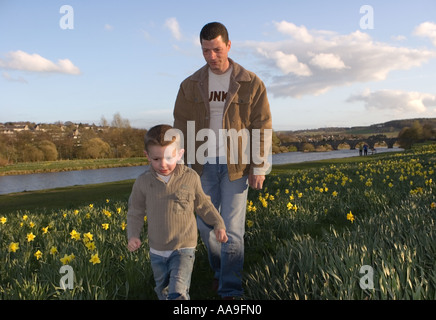 Father and son on Riverside daffodil walkway Aberdeen city, Scotland, uk Stock Photo