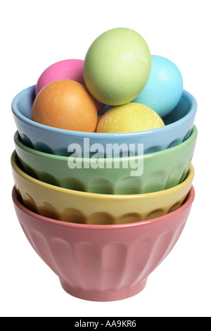 Stack of colored bowls with dyed Easter eggs. Stock Photo