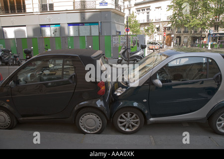 Smart cars parked touching bumper to bumper in Paris Stock Photo