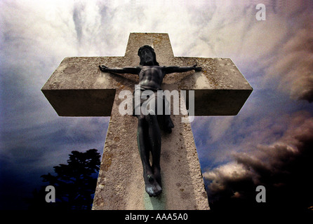 Grave, headstone, death, A cross in a graveyard showing Jesus Christ Stock Photo