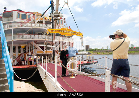 Passengers being photographed on the  Mississippi Queen paddlewheeler moored in downtown St Paul. St Paul Minnesota MN USA Stock Photo