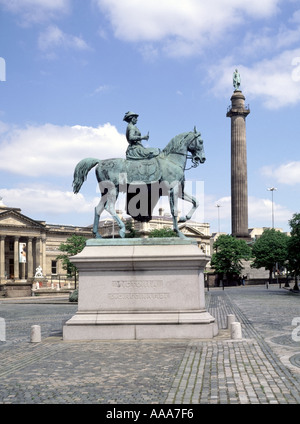 Liverpool St Georges Hall Plateau Statue of Queen Victoria on horseback Duke of Wellington column beyond Merseyside England UK Stock Photo