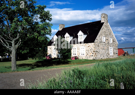 traditional quebec farmhouse on the shores of the st laurence river canada Stock Photo