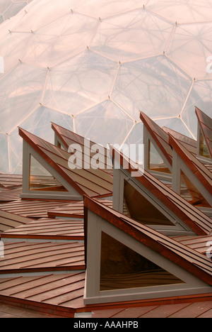 THE EDEN PROJECT BIOMES WITH THE CORE EDUCATIONAL BUILDING IN THE FOREGROUND NEAR ST AUSTELL IN CORNWALL UK Stock Photo