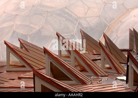 THE EDEN PROJECT BIOMES WITH THE CORE EDUCATIONAL BUILDING IN THE FOREGROUND NEAR ST AUSTELL IN CORNWALL UK Stock Photo