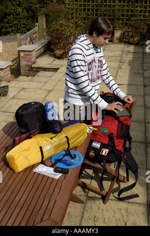 Boy packing rucksack for camping trip Stock Photo - Alamy