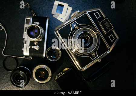 Classic German analogue cameras - a 35mm Leica M3 and a 6x9 cm Bertram press camera. Stock Photo