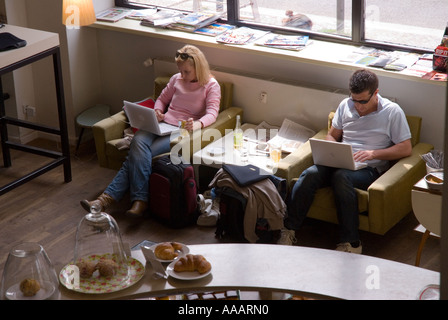 People on laptop computers in an internet cafe in Berlin Stock Photo