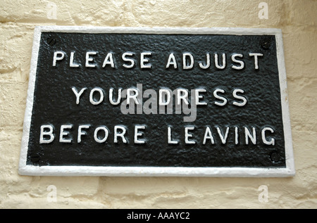 Please adjust your dress before leaving sign Stock Photo
