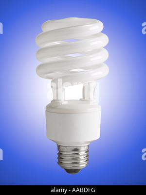 Energy Efficient Compact Fluorescent Light Bulb, CFL Bulb Glowing In Studio Still Life Stock Photo