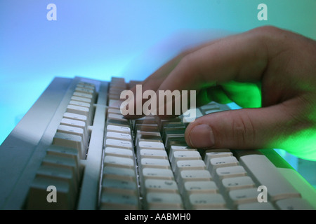 computer keyboard with hand and numerical code Stock Photo