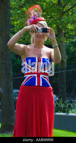 Young woman wearing an union jack bustier at Royal Ascot ladies day Stock Photo
