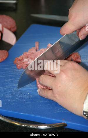 cutting sausages Stock Photo