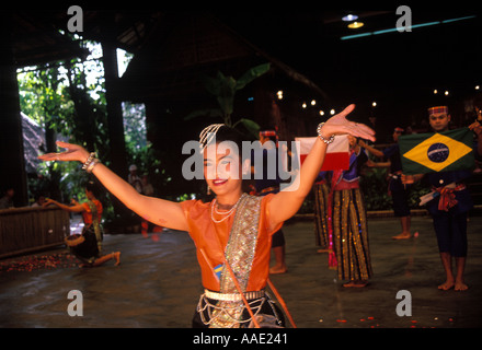 Thai cultural dancers at the Rose Garden Cultural Show for tourists in Bangkok, Thailand performing for an audience of visitors to the show Stock Photo