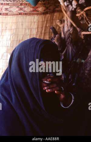 Algeria.Near Tamanrasset Tuareg woman face decorated with henna A rare photo as difficult to photograph women here. Stock Photo