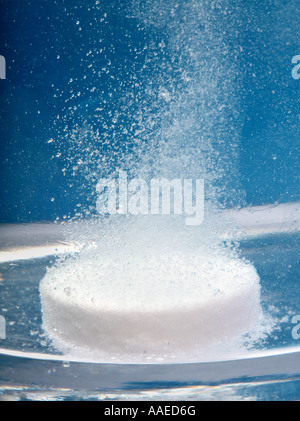 tablet dissolving in a glass of Water Stock Photo