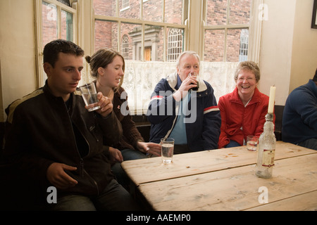 UK England West Midlands Dudley Black Country Museum Bottle and Glass pub visitors sat in window seats Stock Photo