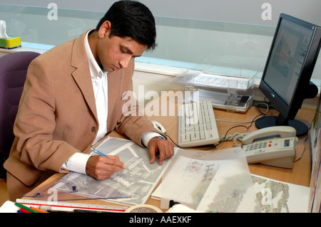 Urban designer working on plans Stock Photo