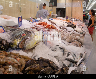 Fresh fish selection on display within a Spanish Supermarket, with a large mahi-mahi, dolphinfish or dorado in the foreground, Spain Stock Photo