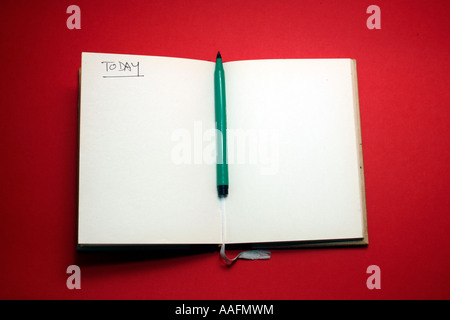 Open notebook with pen and blank page Stock Photo