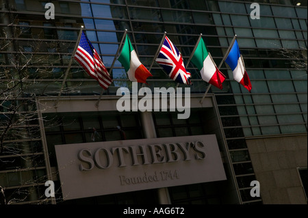 Flags flap in the sun on the facade of Sotheby s on York Avenue in New York City USA April 2006 Stock Photo