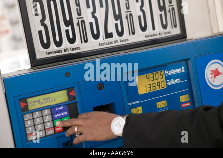 Filling up the car at a gas station in Harlem New York City USA April 2006 Stock Photo